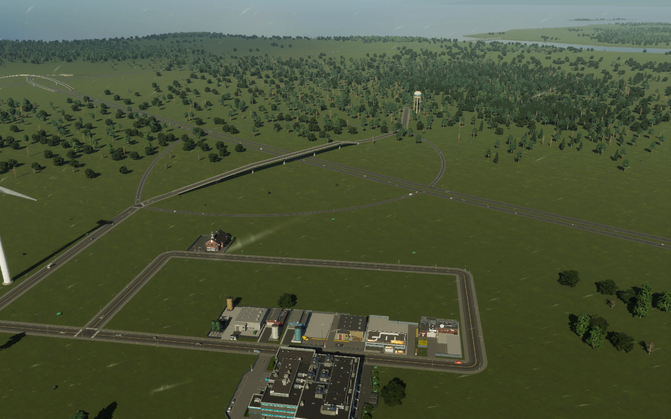 The existing freight loop, local firehouse and highway crossing during the service survey. No additional freight land was purchased this session.