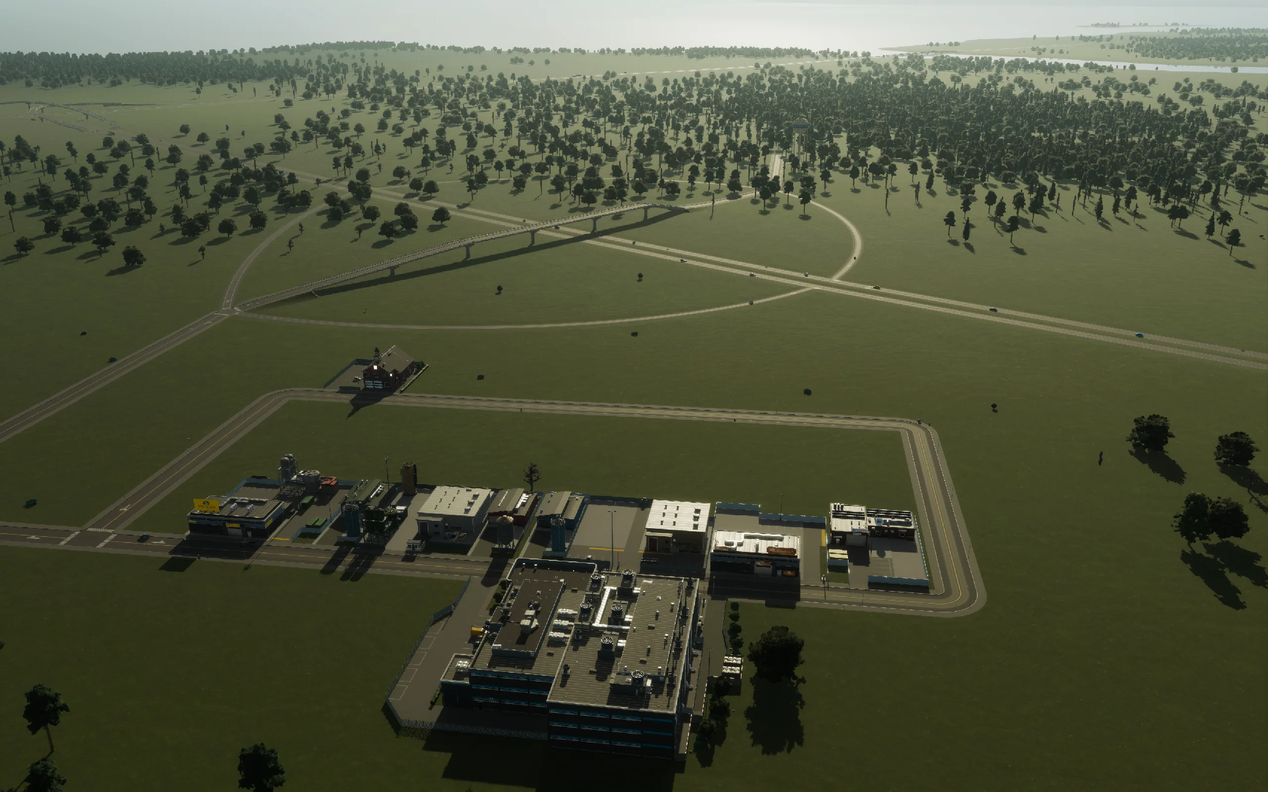 The freight loop after both infill factories completed, bringing the district to eight factory buildings on its existing roads.