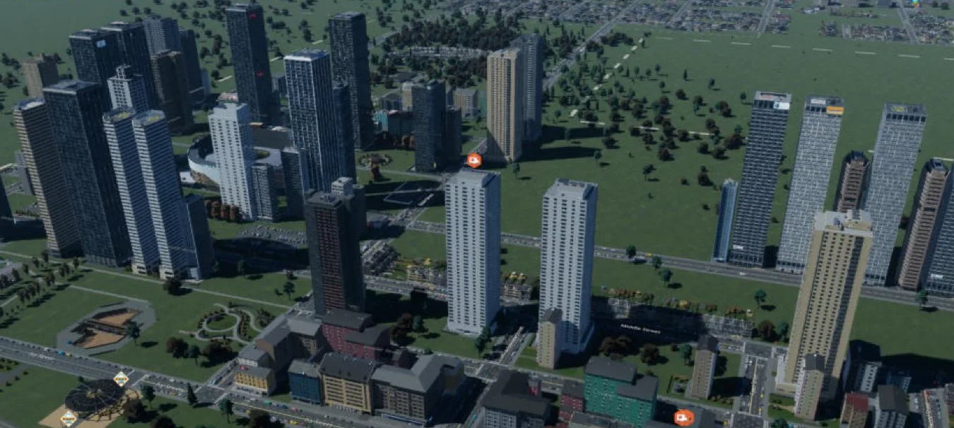 View from the station side: mixed-use blocks along the boulevard with new towers rising behind them.