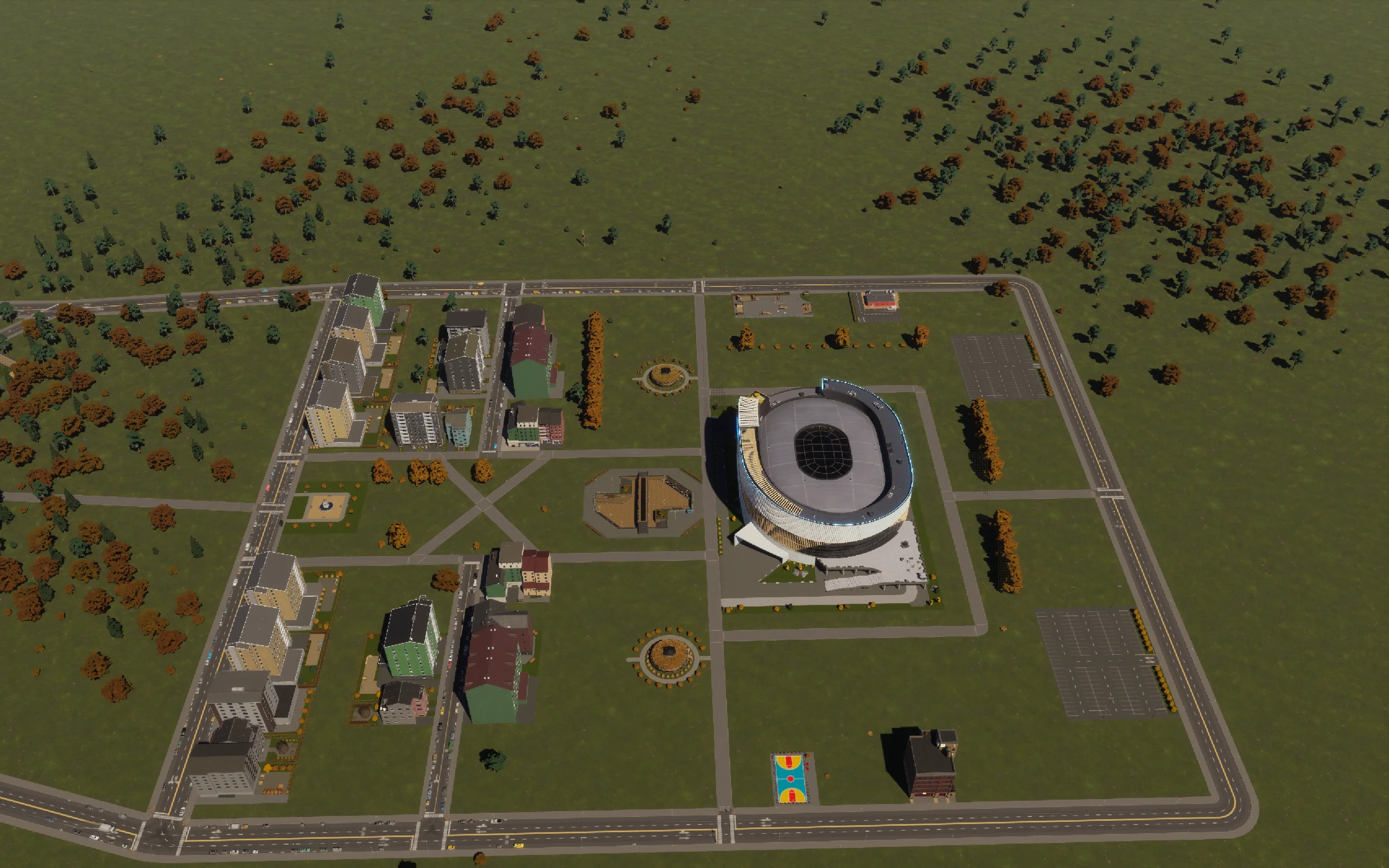 Apartments, cafés and tree rows around the arena frontage.