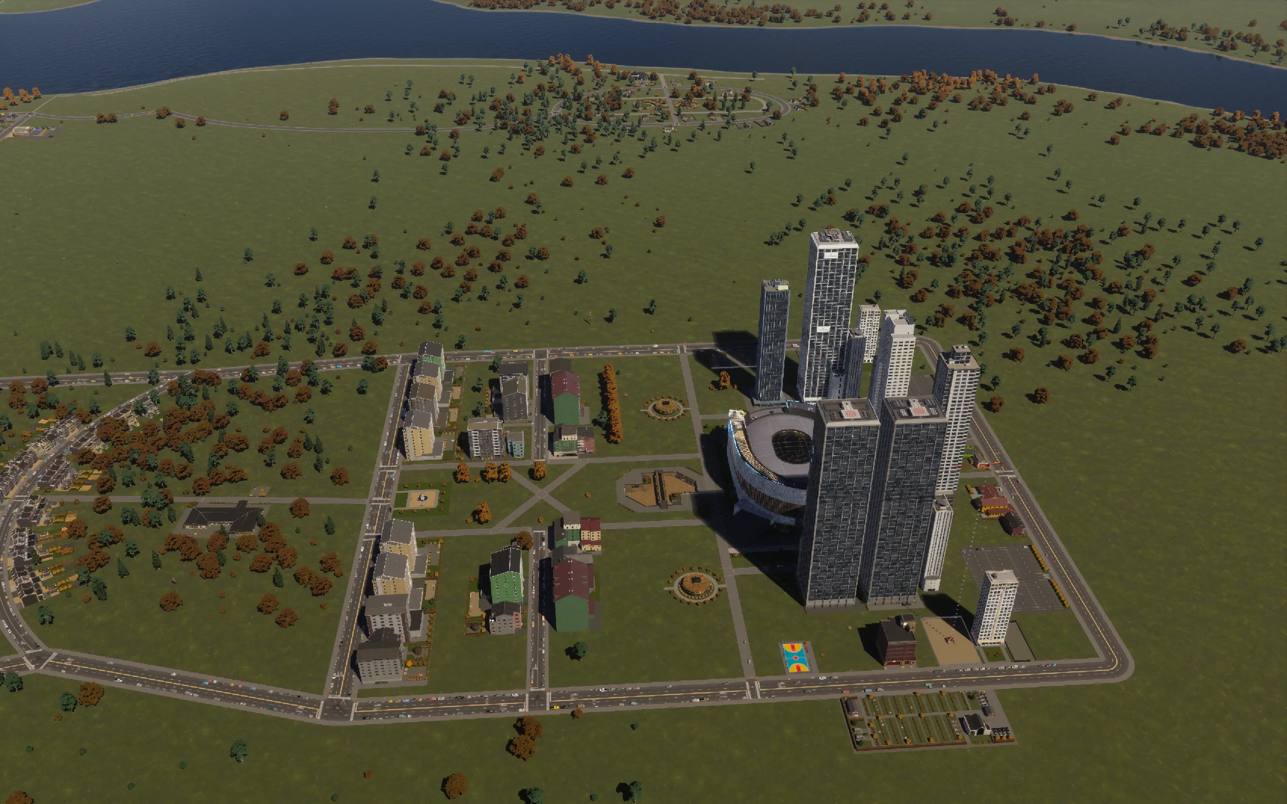 Early in the session: the first tower group rises around the existing arena neighborhood.