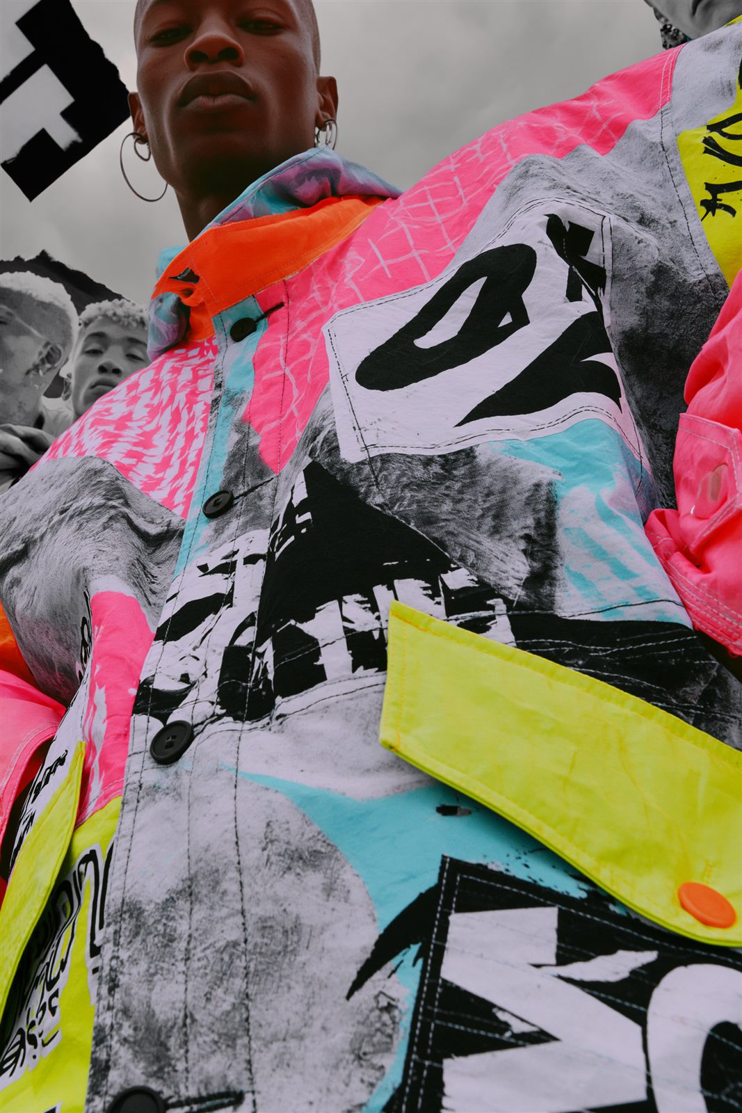 Fashion editorial — model in a neon patchwork jacket
